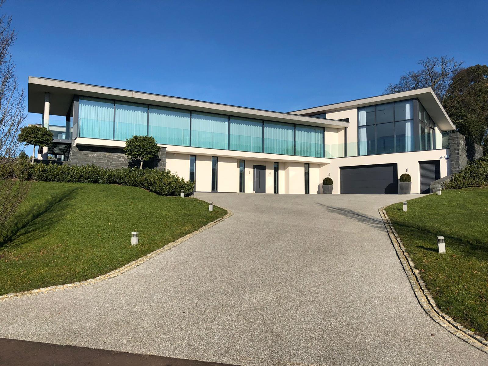 Contemporary residence with full-height glazing and glass balustrades